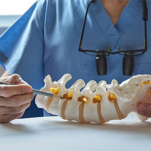 doctor using spine as visual aid.