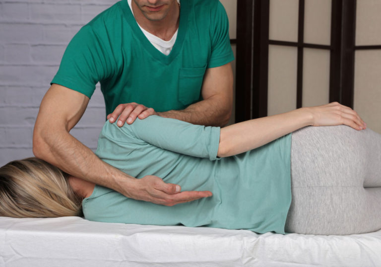 professional doing a spine alignment.